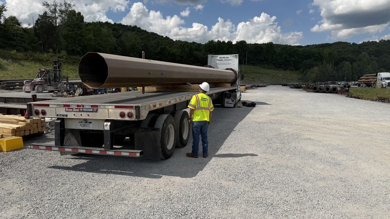 Steel pipe loaded on flatbed trailer