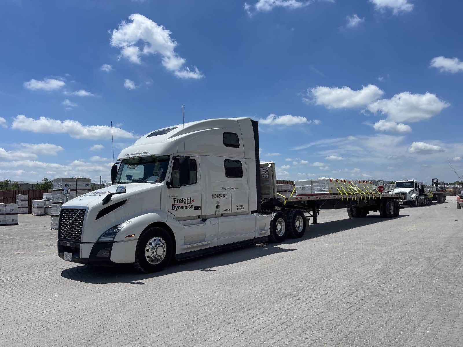 Freight Dynamics tractor with 53-foot flatbed trailer